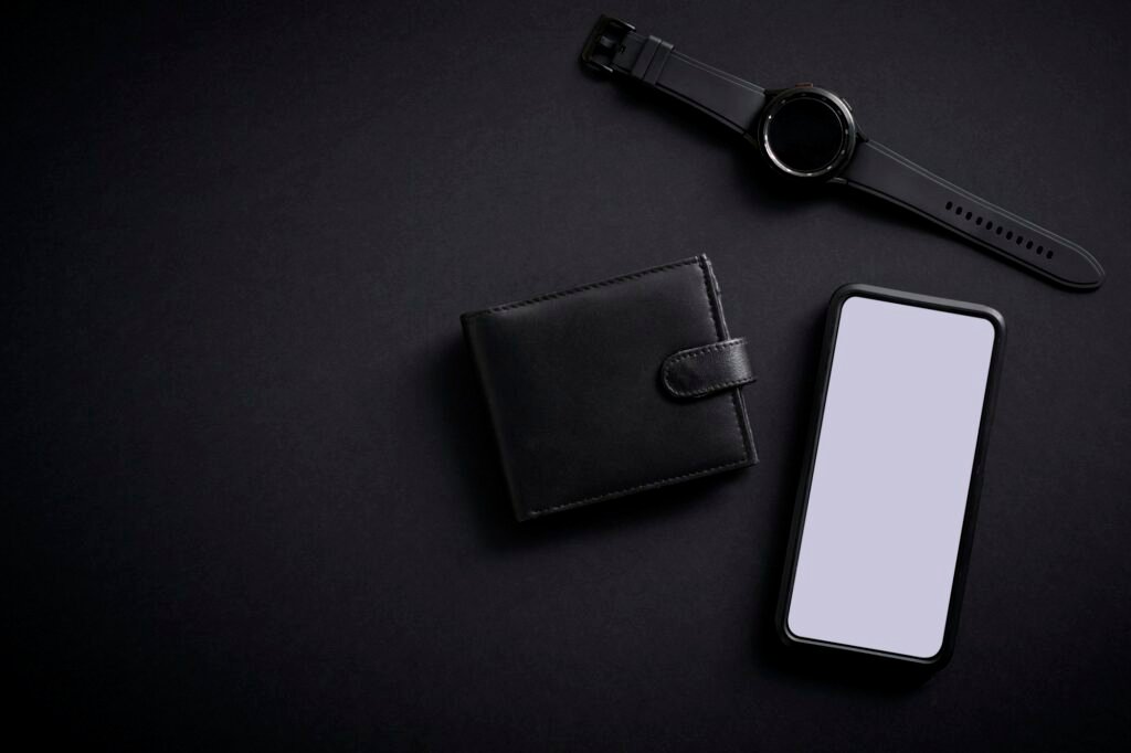 Overhead Flat Lay Shot Of Mobile Phone With Smart Watch And Wallet